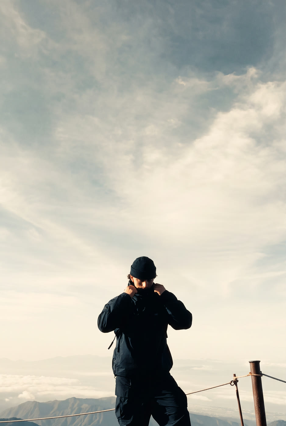 Devyn Butkiewicus above a sea of clouds on Mount Fuji